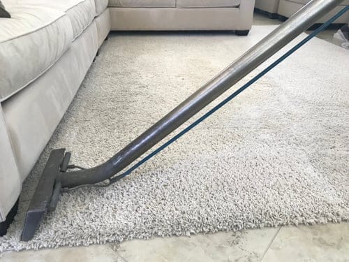 Professional carpet and upholstery cleaning in progress in a Hanford, CA home