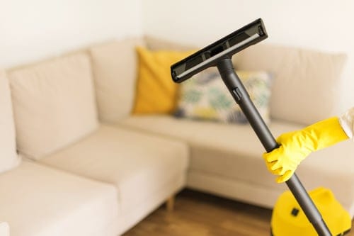 Professional deep cleaning of an upholstered sofa during a whole-home deep clean in Hanford, CA