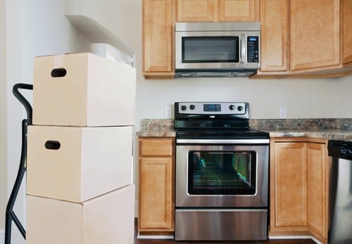 Moving boxes in a kitchen prepared for move in and move out cleaning in Hanford, CA